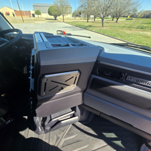 Mack PR64T76H truck cabin interior showing dash, insulated center console, and metallic panel labeled MACKS inside the cab
