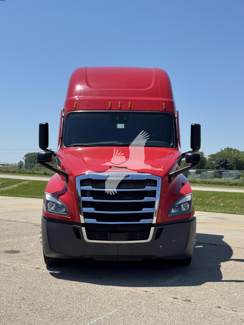Front view of a red Freightliner Cascadia 126 truck with large grille, black bumper, side mirrors, and sleeper cab visible.