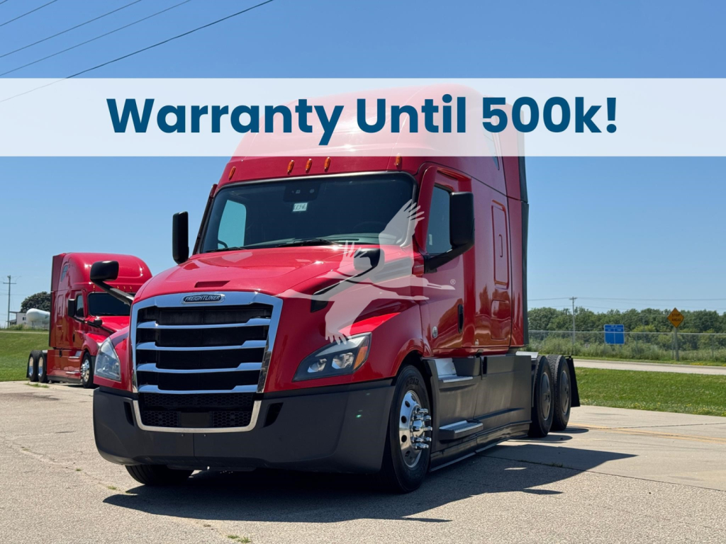 Truck in red cab showing Freightliner Cascadia 126 with warranty banner across top.