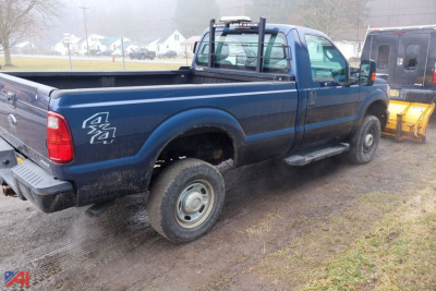 Ford F-350 Super Duty pickup with single rear wheel showing 4x4 badge and bed in view.