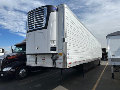Utility reefer trailer in white with front refrigeration unit and raised landing gear showing 2026 Utility 3000R model.
