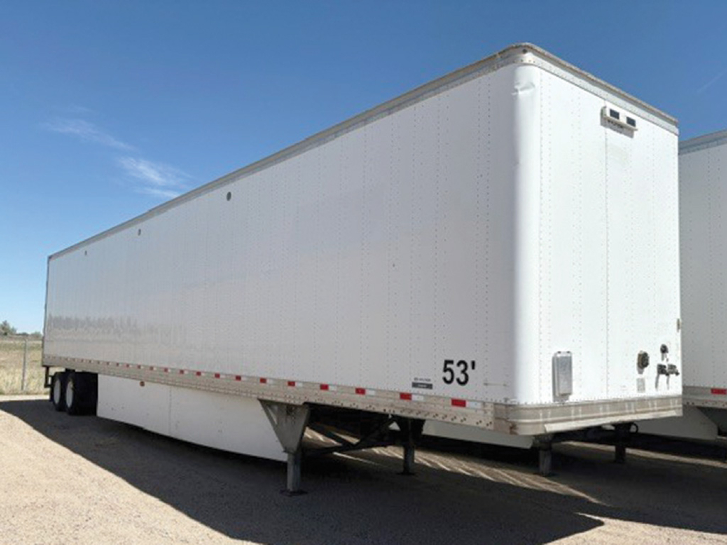 Hyundai Translead 53' white dry van trailer side and front corner, stake legs deployed, no visible branding aside from 53' marking, VIN HT016349 visible in listing.