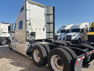Truck cab and rear chassis of a 2022 International LT625 tractor showing sleeper cab and dual rear axles.