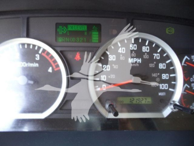 Isuzu truck dashboard cluster with speedometer up to 80 mph, tachometer, digital display, and various indicators visible.