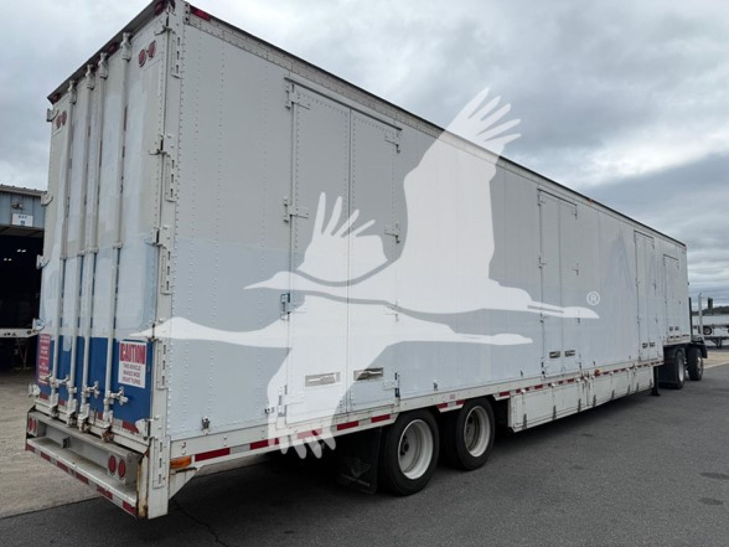 Kentucky Trailer moving van trailer with triple-axle rear, white exterior, rear doors, VIN 1KKVE5322DL233955, stock 7490, used condition.