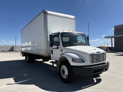 Box truck side view showing 2022 Freightliner M2-106 medium-duty with a large box cargo area and cab, front grille, and headlights visible.