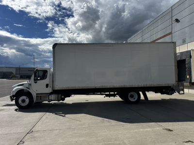 Freightliner M2-106 box truck side view showing cargo box and cab.