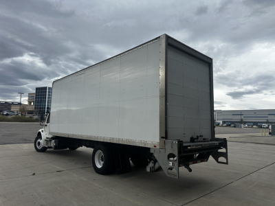 Freightliner M2-106 box truck rear-right angle showing cargo box and rear chassis