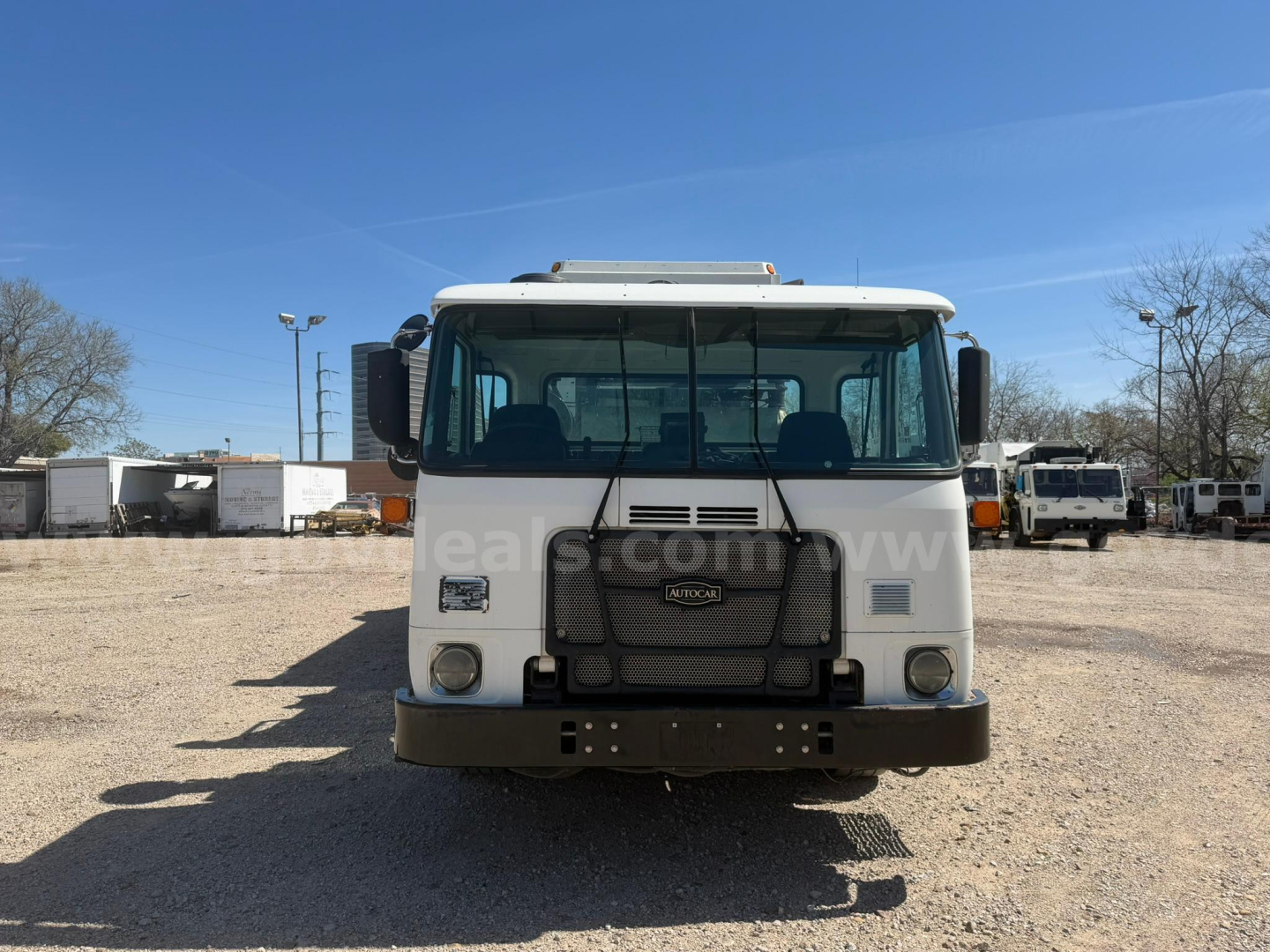 2018 Autocar Xpeditor front view showing Cab and grille, large bumper, headlights, and windshield with side mirrors.