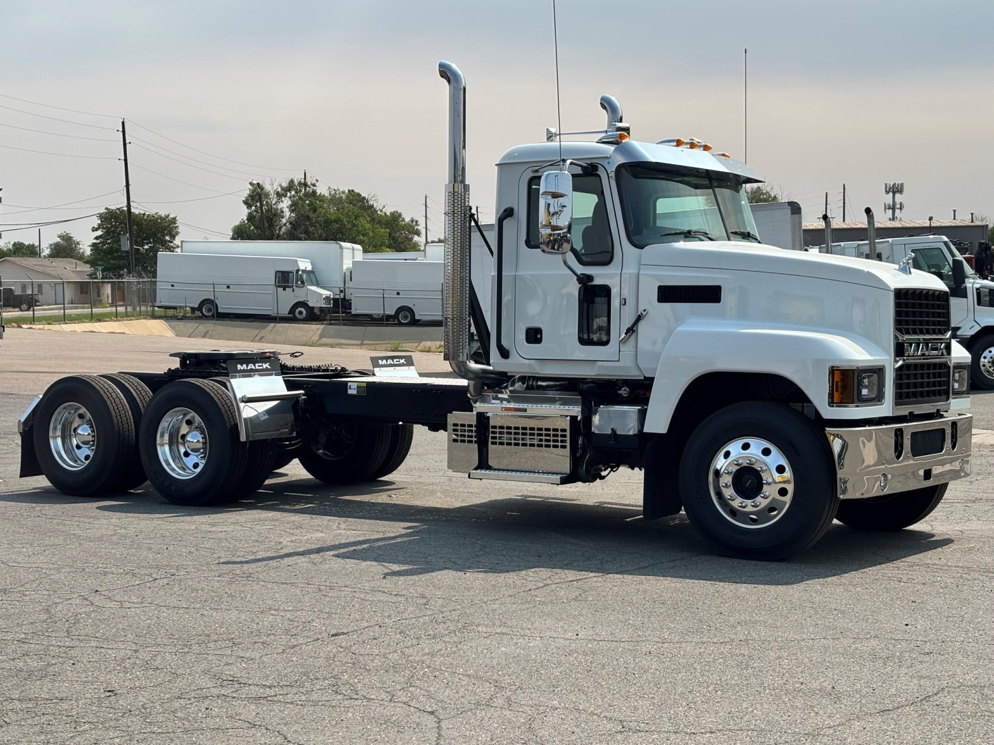 Mack PI64T conventional daycab truck in side view showing chassis, cab, exhaust stack, front grille, and dual rear axles.