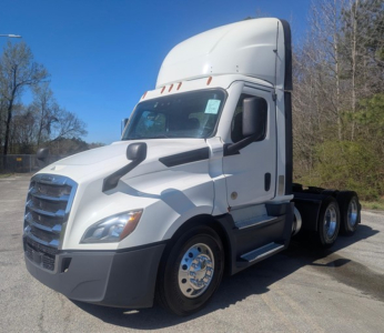 Freightliner Cascadia 126 truck cab in white, side view showing front grille, wheel hubs, and sleeper cab.