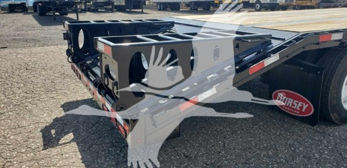 Dorsey Beavertail Dropdeck trailer chassis showing rear deck and wheel area with logo watermark
