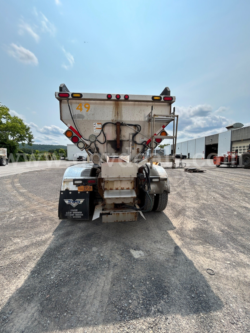 Rear view of 2017 Kenworth T800 dump/plow truck showing tail lights, hitch, and equipment. Visible numbers: 49 on hopper, VIN 1XKDD70X8HR135086 on listing data.