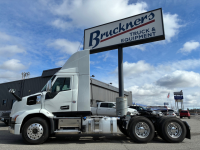 Truck and Equipment image showing a white Mack AN64T daycab with dual rear axles and fuel tanks in view.