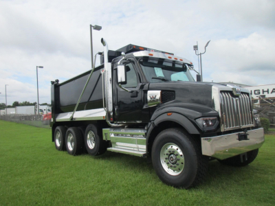 Western Star 49X dump truck with black cab and chrome accents, 6x4 configuration, side view.