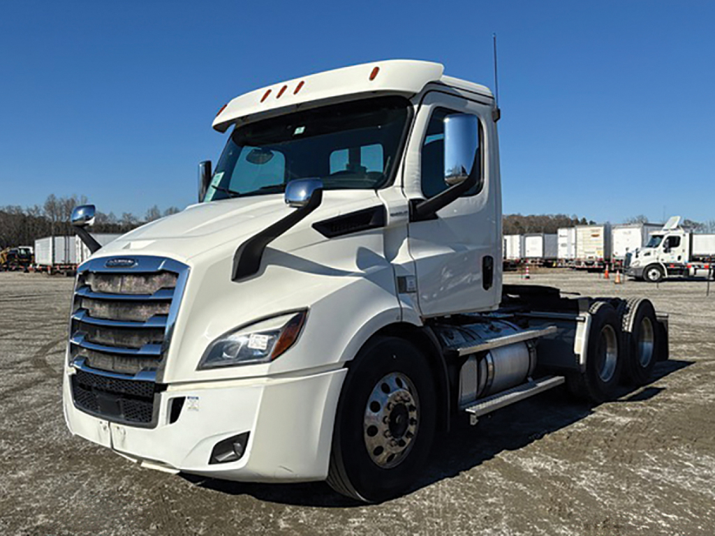 Truck front and side view showing Freightliner Cascadia 116 badge area and cab, no visible text on components in close-up.