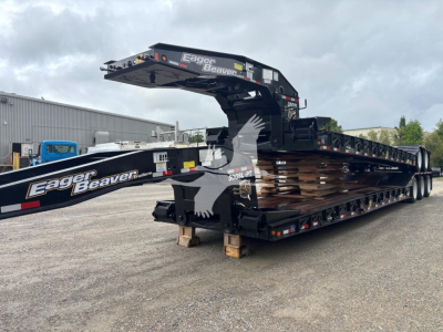 Eager Beaver 50Gsl-Pt trailer in a lowboy configuration with gooseneck arm, side rails, and multiple axles. Visible branding 'Eager Beaver' on the arm and deck.