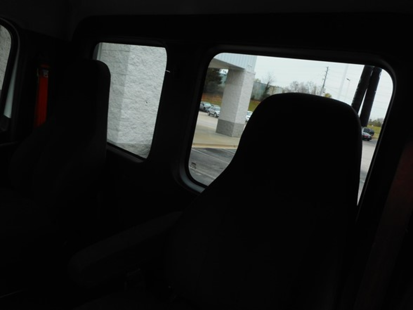 Cab interior of a Freightliner Cascadia showing seats and windows; no readable technical labels or fluid reservoirs visible.