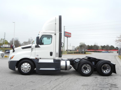 Freightliner Cascadia 126 day cab side profile showing front half with sleeper exhaust stack and chassis, white cab, two rear axles, no trailer.