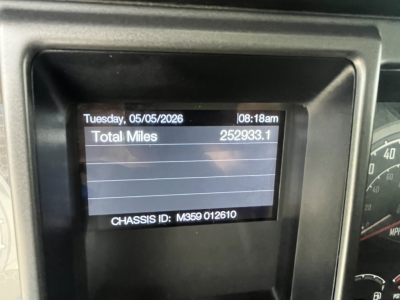 Dashboard display showing odometer 252,933.1 miles and chassis ID M359012610 on a Mack GR64F truck.
