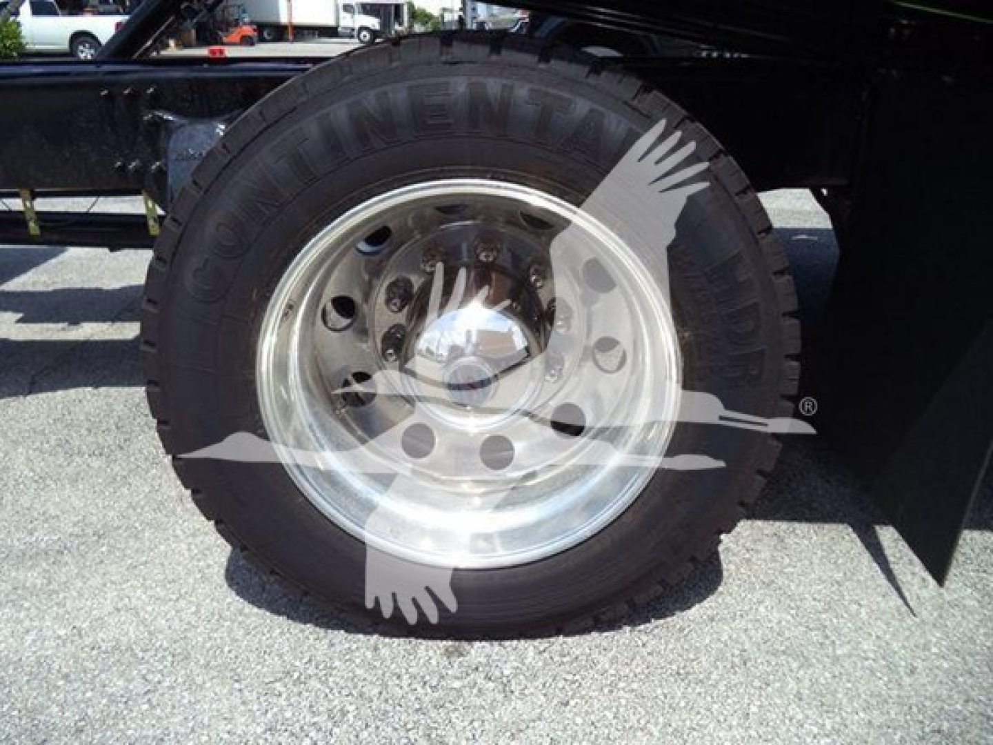 Freightliner M2 106 Plus rollback truck wheel showing Goodyear tire and polished steel rim.