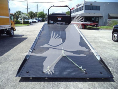 Freightliner M2 106 Plus rollback truck flatbed in-service with diamond plate steel deck
