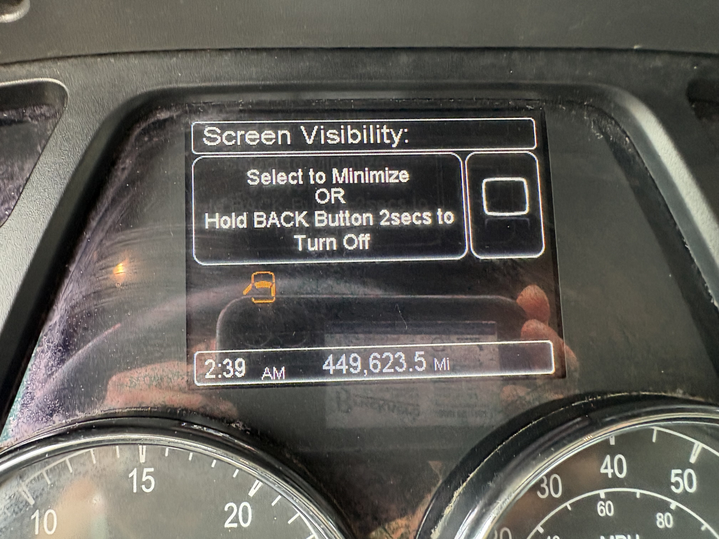 Vehicle cockpit screen displaying Screen Visibility settings with a 2:39 AM readout and 449,623.5 miles on a Peterbilt 579.