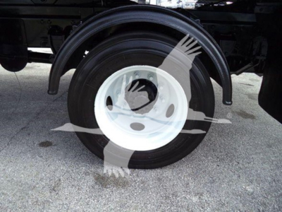 Wheel and fender area of a 2017 Hino 258LP hooklift truck showing white steel wheel with black tire and surrounding undercarriage.