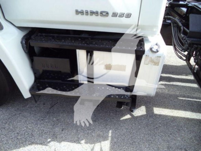 Hino 258LP truck rear showing access step and body panel with HINO 258 badge and hooklift truck gear