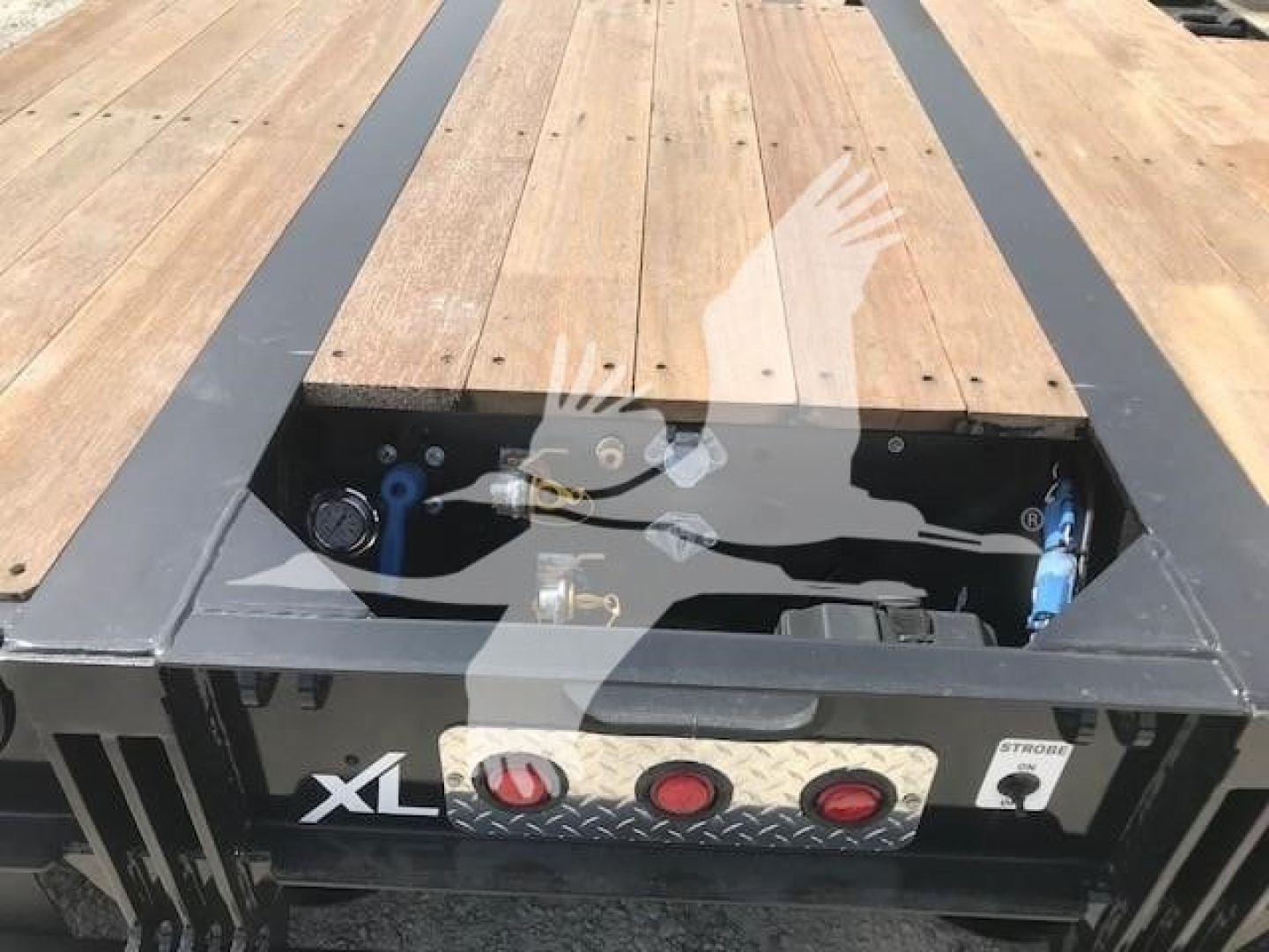 Trailer deck area showing toolbox and controls on XL Specialized XL80Mfga lowboy trailer with wooden deck.