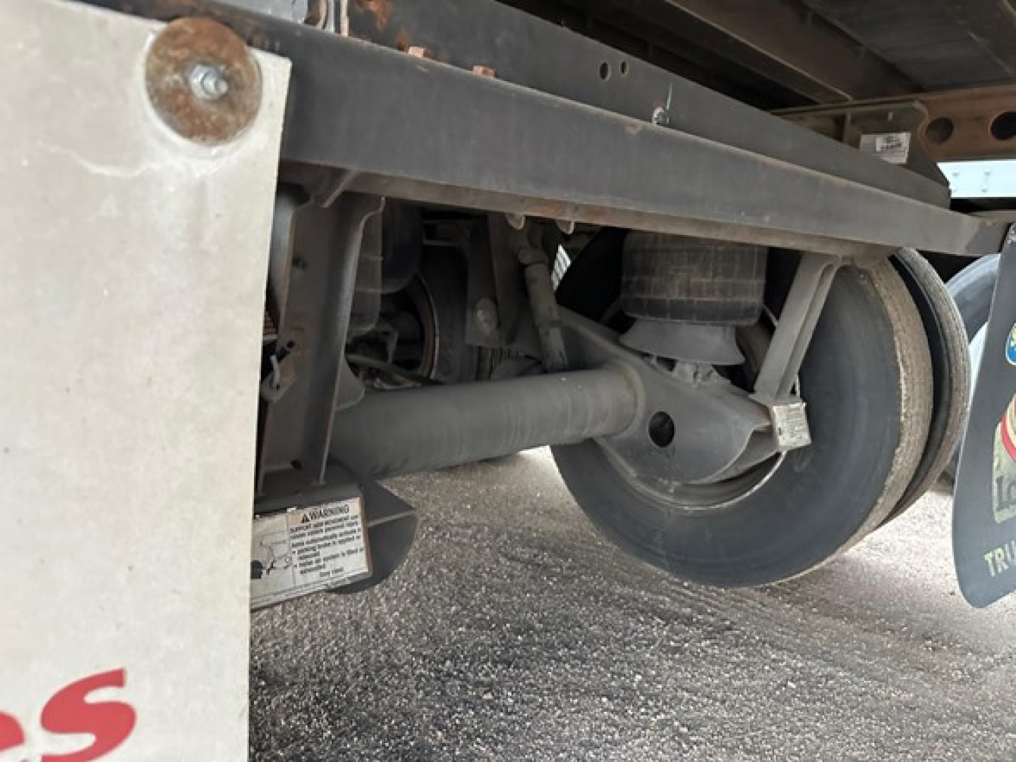 Trailer undercarriage showing wheel and suspension components of a Hyundai air ride dry van in-service condition.