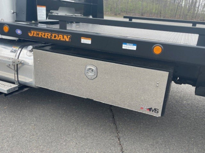 Kenworth truck side view showing aluminum toolbox under chassis with JERR-DAN branding and MS logo