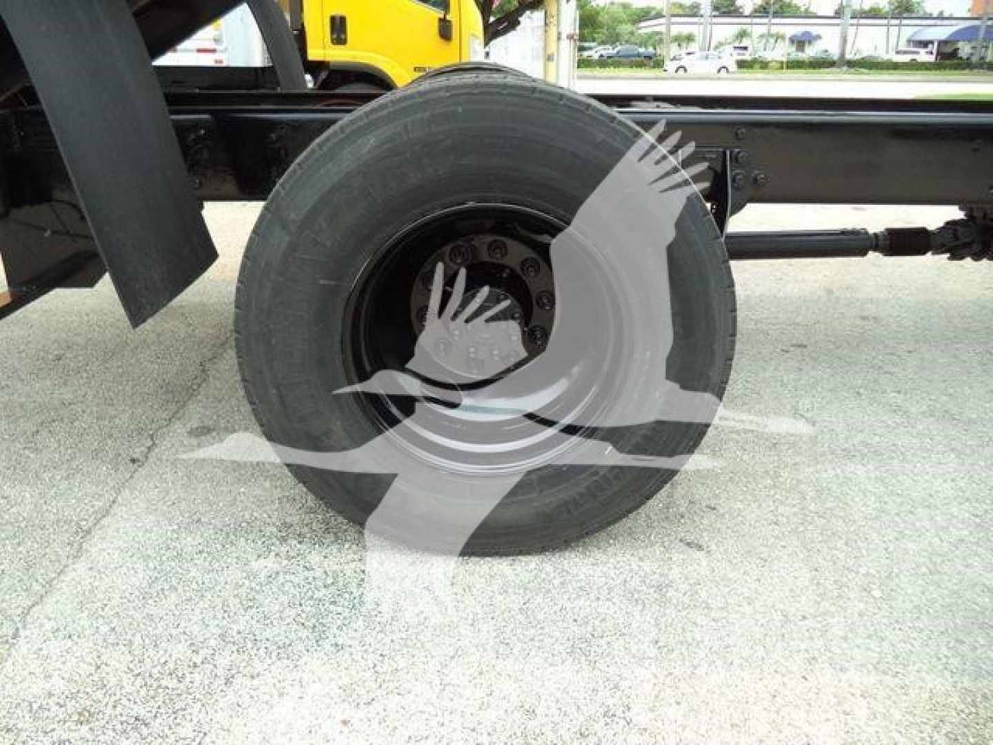 Wheel of a 2019 International 4300 dump truck showing rear tire and axle components.