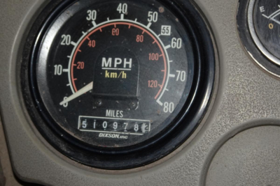 Dashboard speedometer showing MPH and km/h with odometer reading 151,097 miles and a Dixson gauge label.