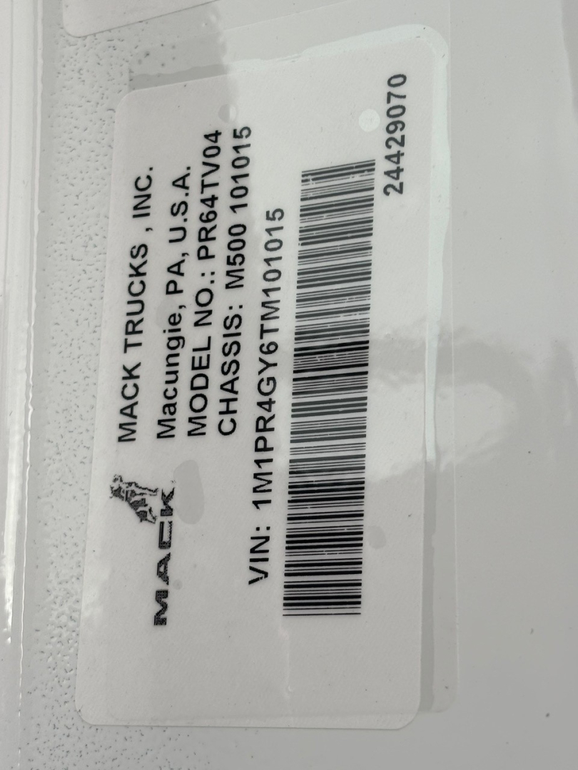 Mack Trucks tag with VIN 1M1PR4GY6TM101015, model PR64T04, CHASSIS NO: PR64T04, MAC K TRUCKS INC label, barcode, stock number 71642, category conventional sleeper