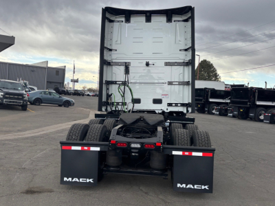 Mack PR64T76H truck rear view showing chassis, fifth wheel, and dual rear tires with mud flaps labeled MACK.