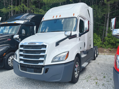 White 2023 Freightliner Cascadia126 sleeper cab tractor in side view showing front grille, headlights, and aerodynamic mirrors.