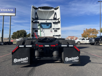Mack PR64T tractor rear view showing mud flaps with Bruckners Truck & Equipment branding and bumper lights.