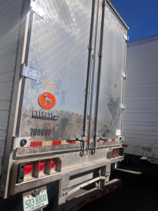 Great Dane air ride reefer trailer rear view showing swing doors and reflective tape.