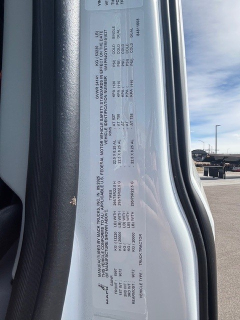 Mack PR64T76H truck data plate visible with vehicle specs and weights in small text.