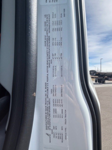 Mack PR64T76H truck data plate visible with vehicle specs and weights in small text.