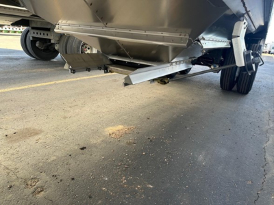 Trailer undercarriage view of a 2026 Timpte Super Hopper showing underside components and landing gear with a focus on the hopper outlet and frame.