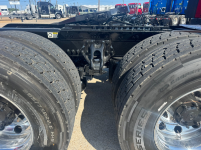 Kenworth T680 rear view showing tandem axle and dual tires with chrome wheels and fifth wheel area visible