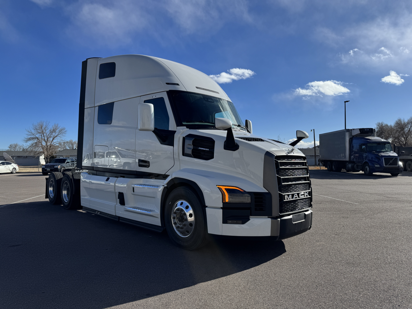 2026 Mack PR64T76H semi-truck tractor in a parking lot, white cab with black grille.