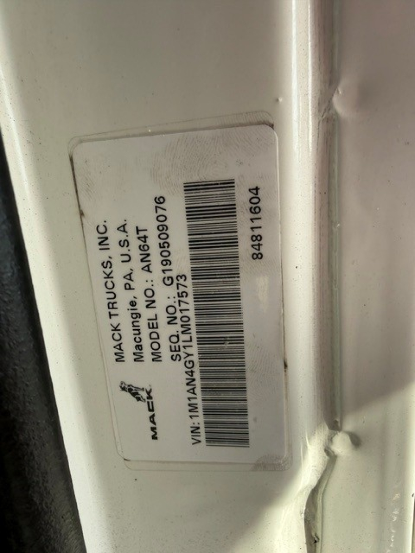 Mack Vehicles VIN label on truck door shows Mack Trucks Inc; Model N/A; 1M1AN4GY1LM017573 label with barcode and various numbers.