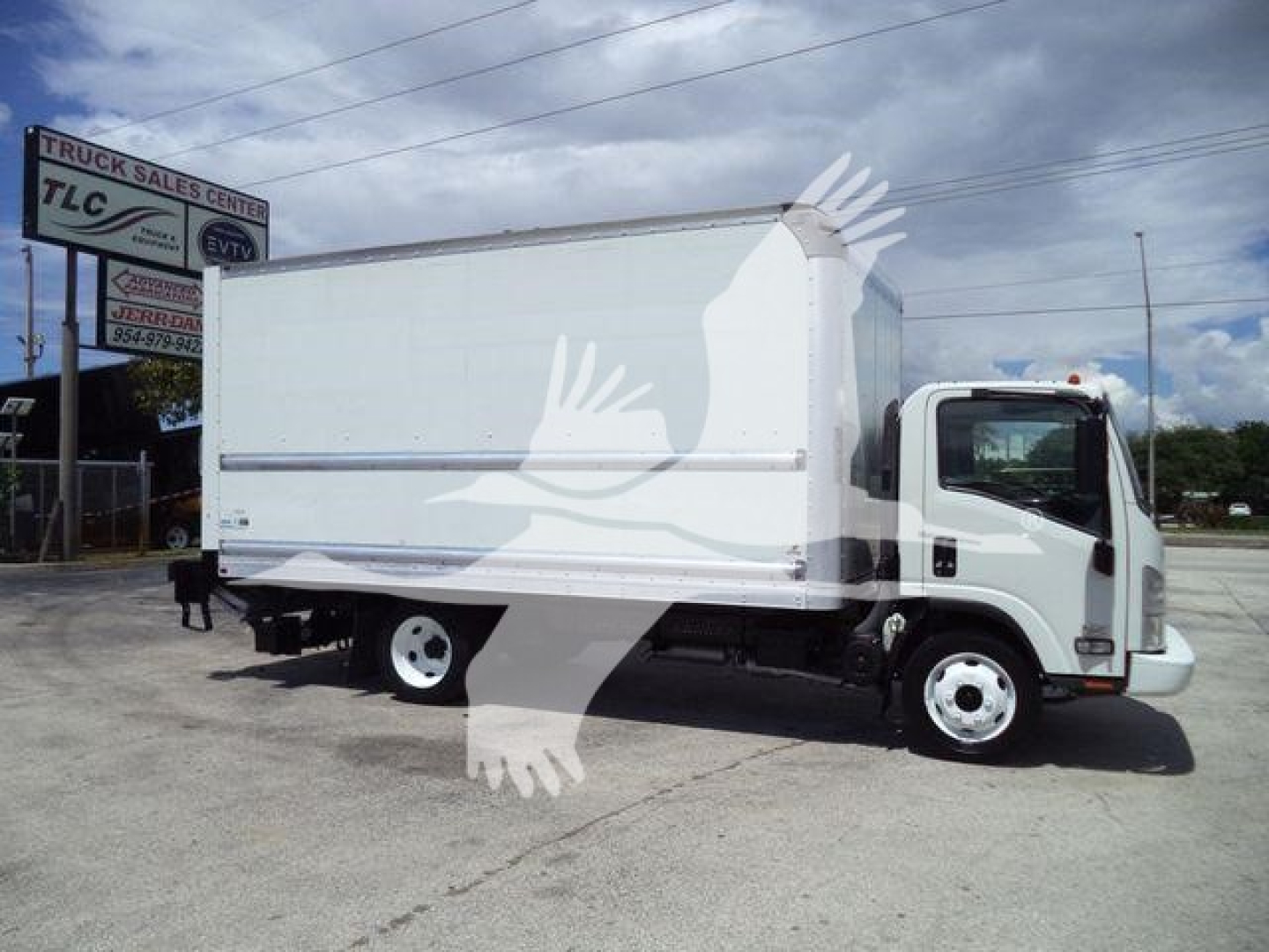 Isuzu NPR HD box truck viewed from side showing cargo box, cab, and dual rear wheels.