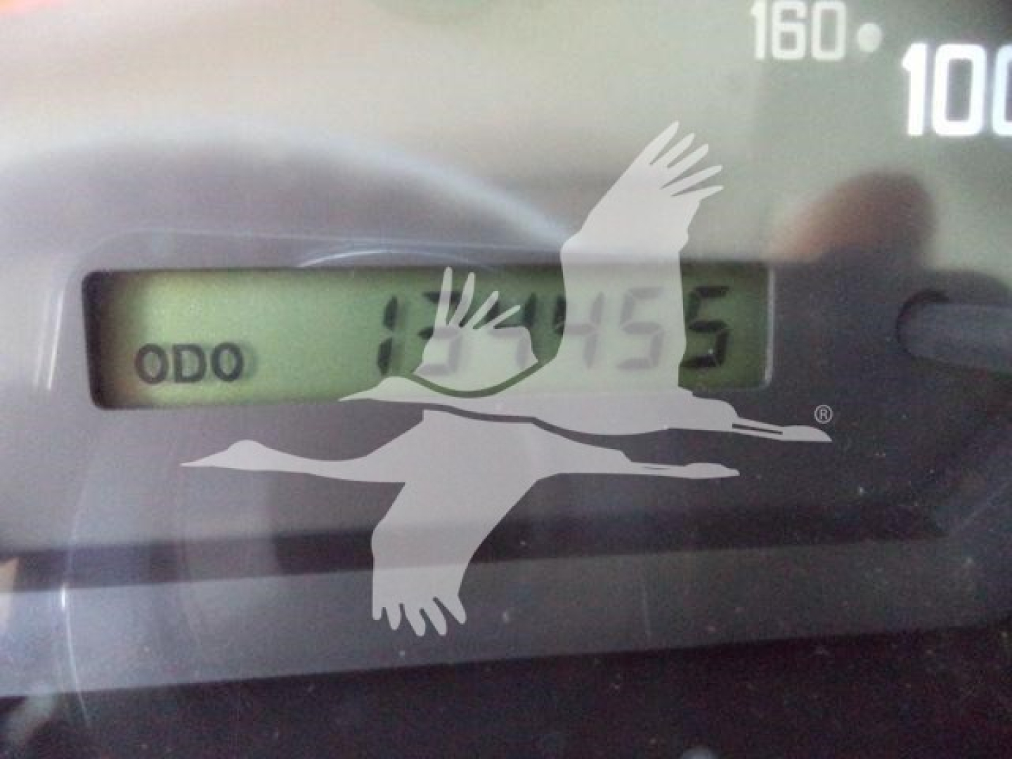 Isuzu NPR HD instrument cluster showing odometer display.