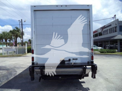 Isuzu NPR HD box truck rear showing back doors and under-recarriage. Large white bird graphic on the rear doors.