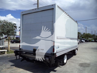 Isuzu NPR HD box truck from rear-right side showing cargo box with white exterior and rear bumper.