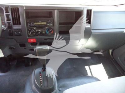 Isuzu NPR-HD dashboard and gear selector view in a used 2016 box truck interior.